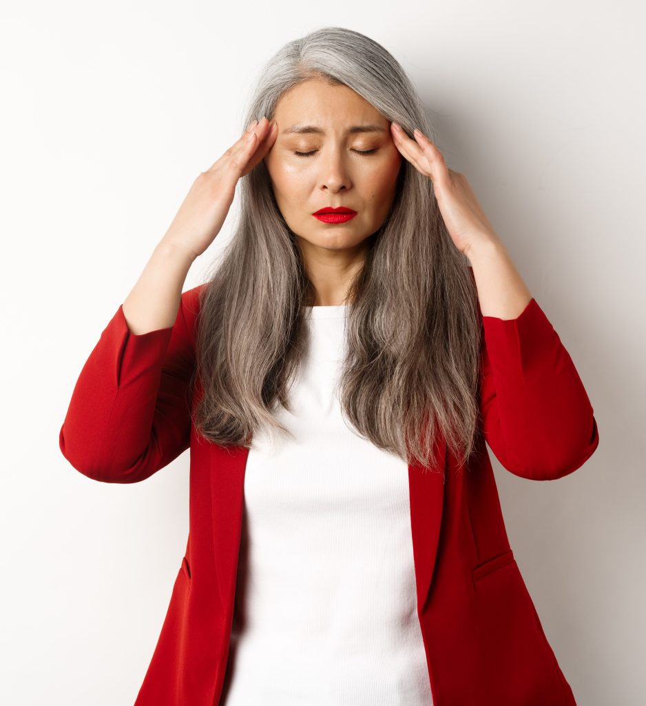 Woman experiencing menopause fatigue, low energy, and exhaustion during midlife